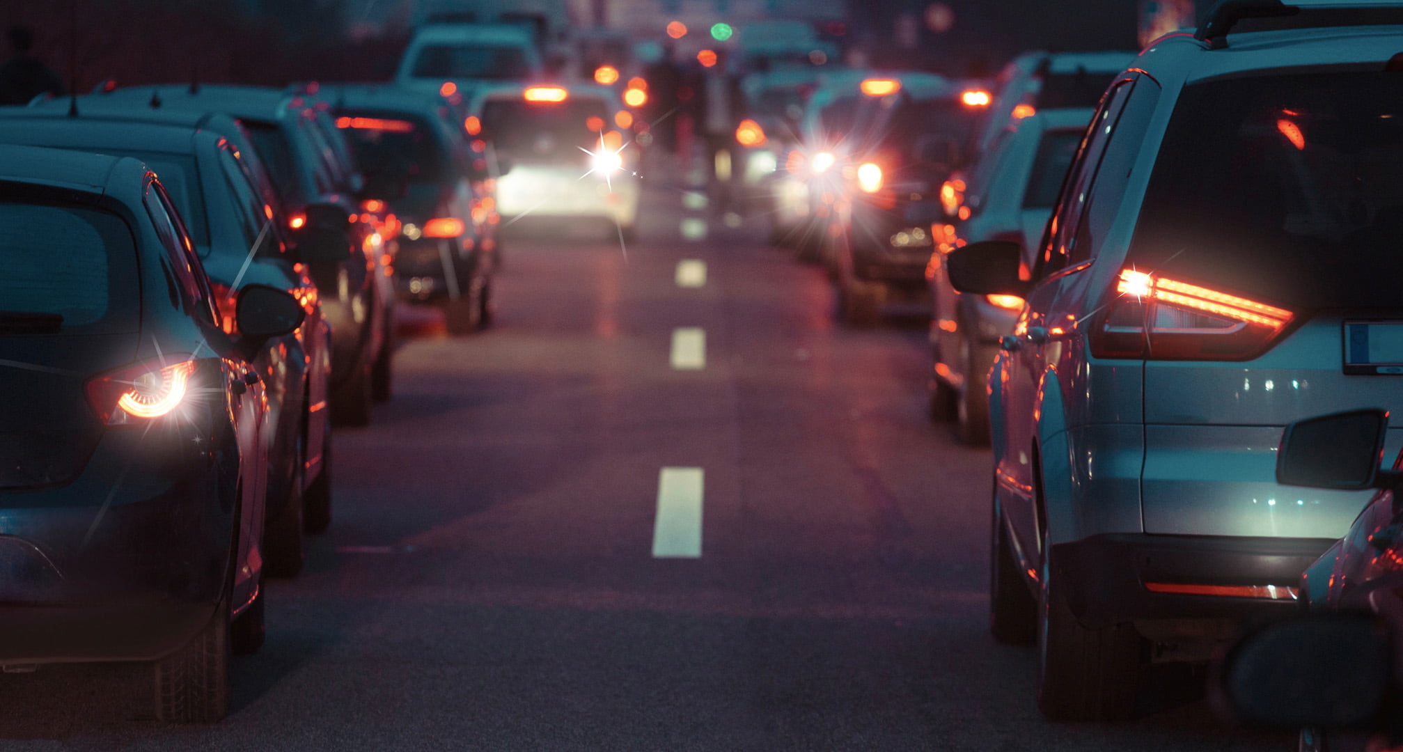 Star-like pattern coming from centre of car tail lights at night caused by astigmatism (left). Clear car tail lights at night seen by normal eye (right)